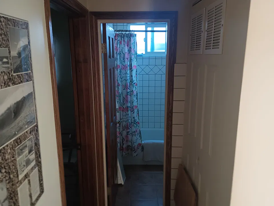 Looking into the bathroom, tile floors throughout keep the unit cool.