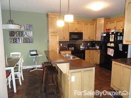 Kitchen/Breakfast Nook
						:
						tile flooring, breakfast nook, custom wood cabinetry, tile backsplash, bar top