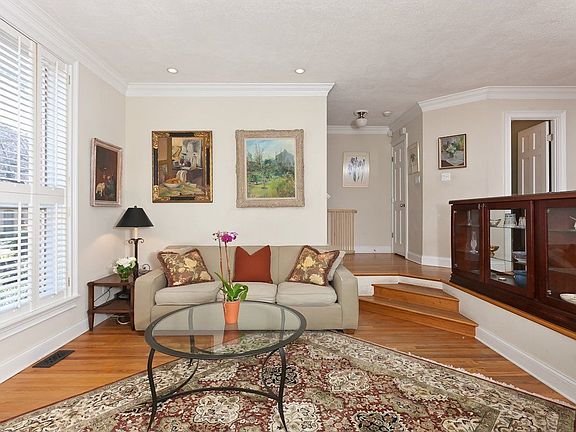 Custom wood plantation shutters with windows looking out to the park