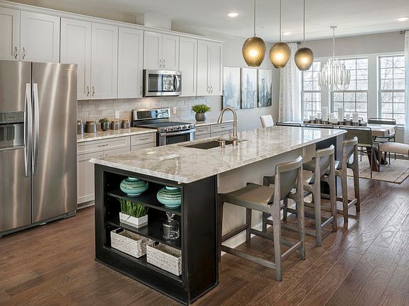 Large center island with additional seating and additional storage