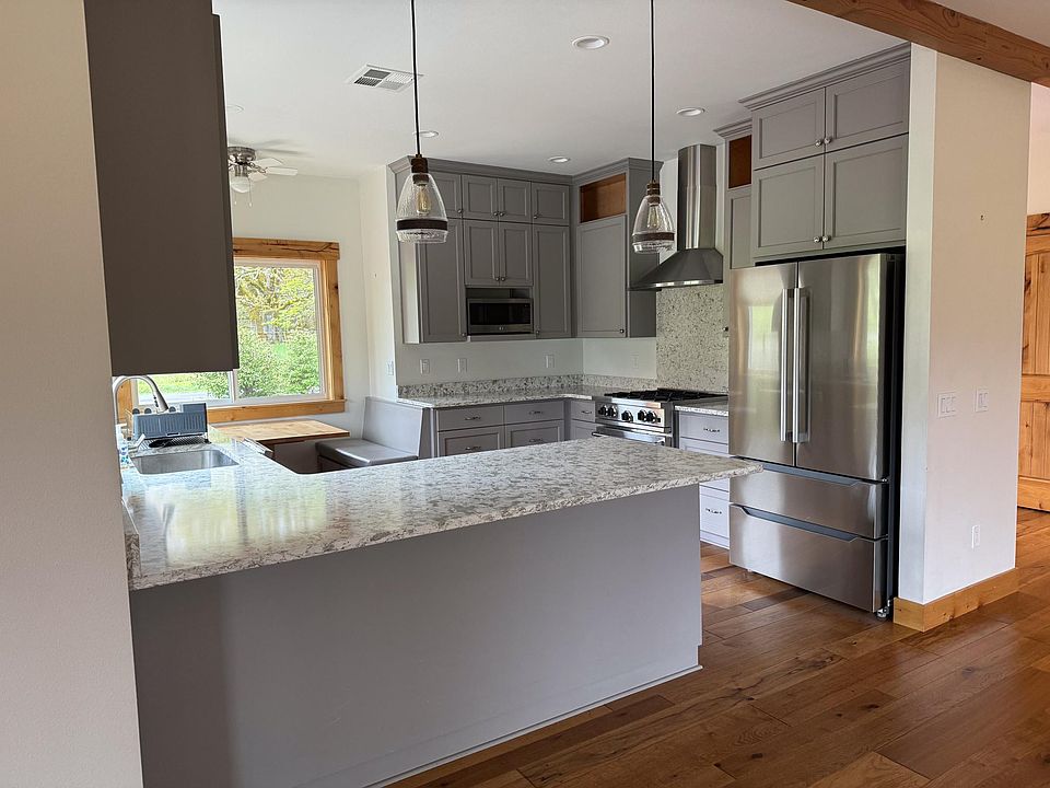 Kitchen peninsula. New refridgerator.