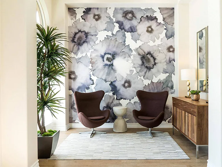 Cozy Seating Area With Bold Floral Wallpaper and Accent Chairs