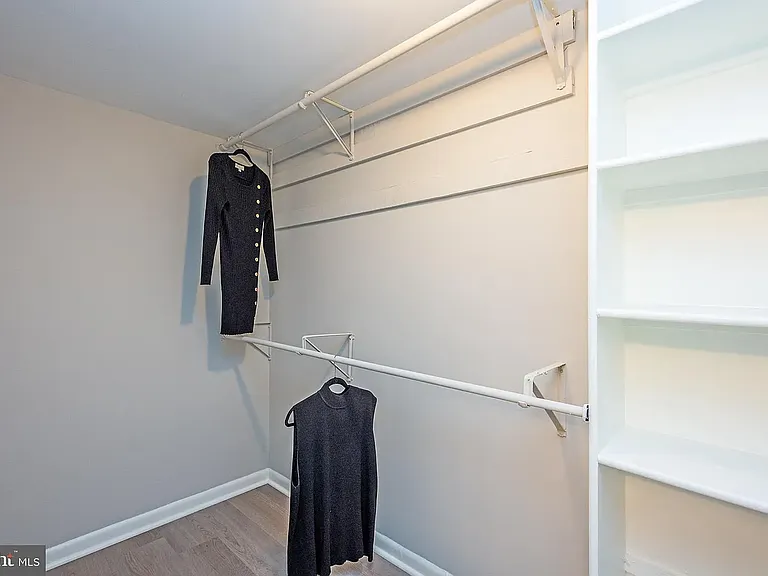 Primary Closet with built-in shelving