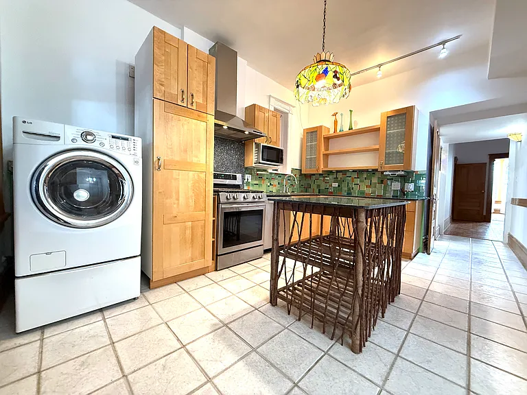 Washing machine / dryer combo next to Ikea pantry