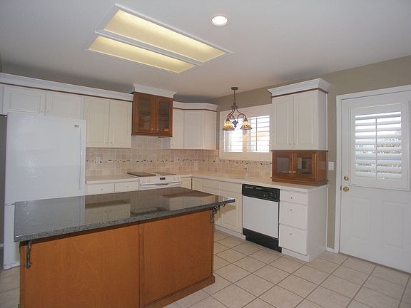 Updated kitchen with slab granite island