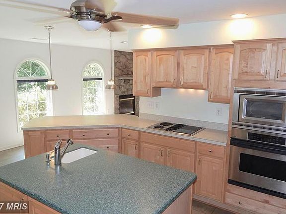 Corian Island w/Sink - SS Ovens, Downdraft Cooktop