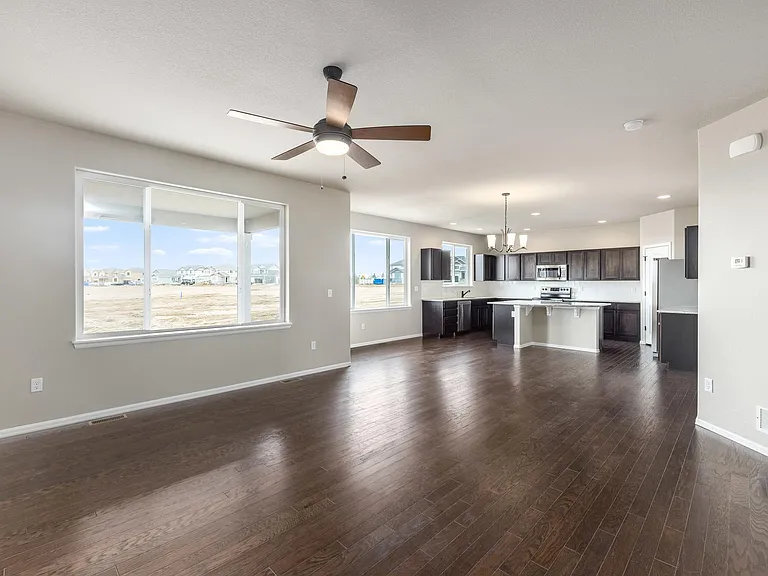 Living Room w/ Dining Area & Kitchen in background