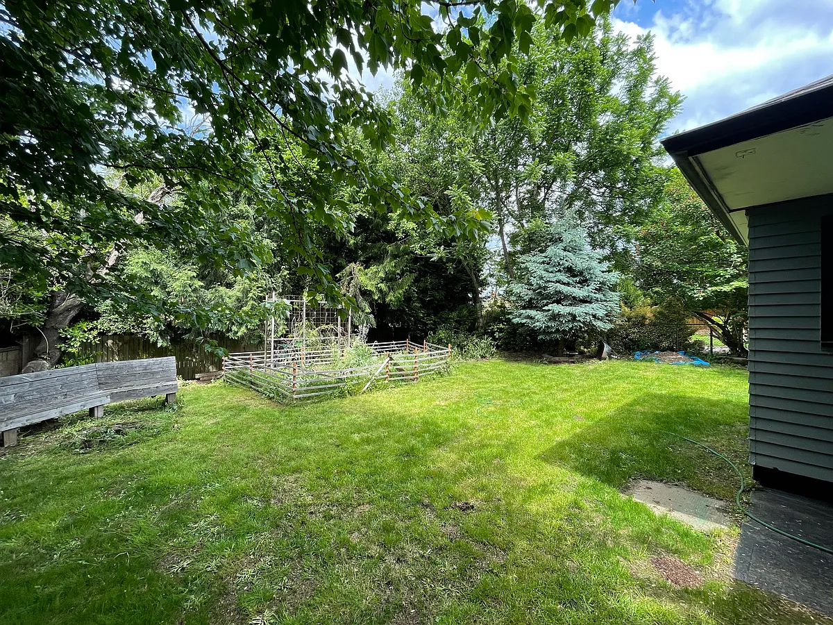 Backyard with garden, bench, fire pit - 3305 NE Liberty St
