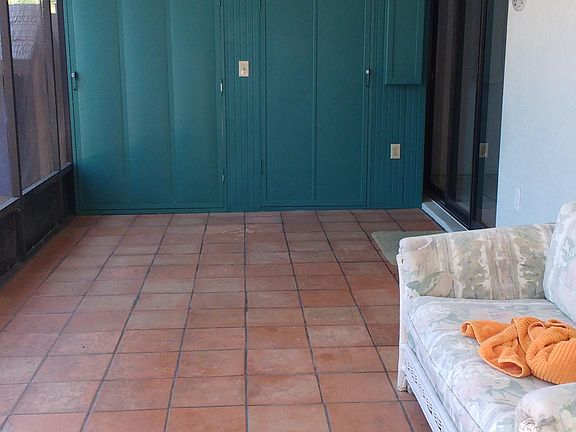 Large screened lanai with 4 ft x 9 ft storage locker