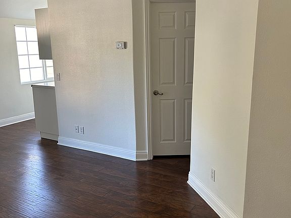 View from studio door toward kitchen, & closet door. The vanity and bathroom are behind short wall on the right of the picture.