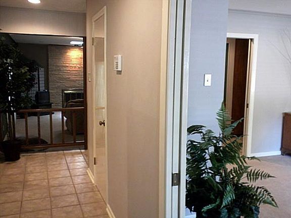View from entryway into livingroom and overlooking den