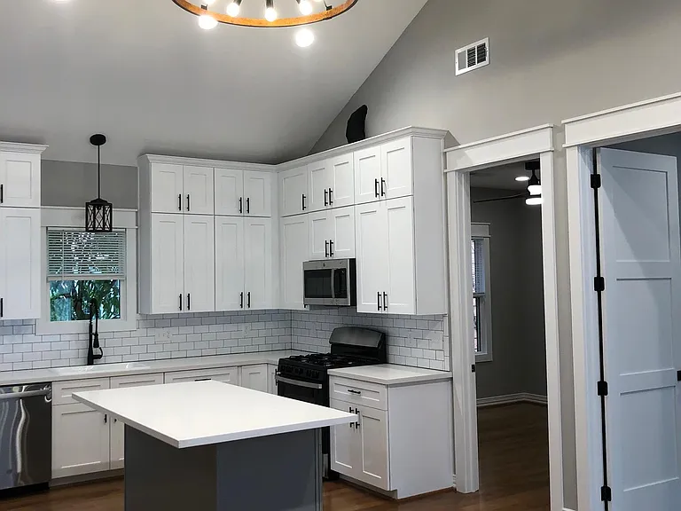 Custom kitchen with plenty of storage, island seating and tons of counter space