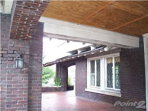 Wrap around covered front porch and entrance.