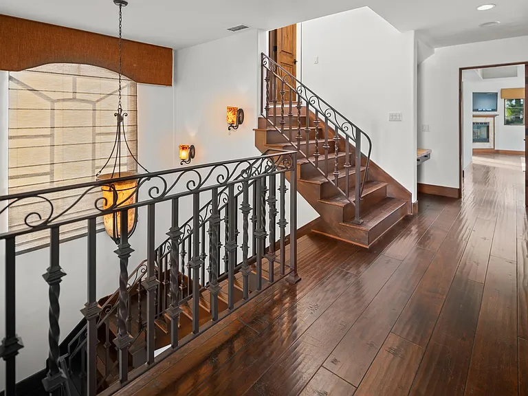 Upstairs hallway and stairs to rooftop deck