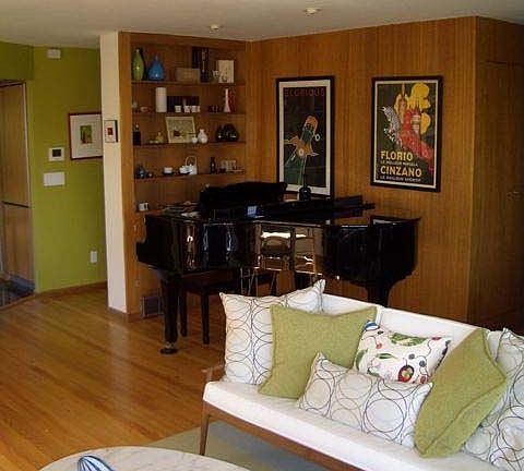 Living room with original mahogany built-ins. Recently refinished hardwoods.