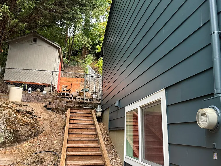 Stairs to the back of the house and tool/ craft shed