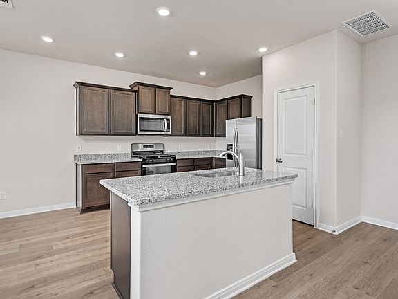 The kitchen island is a wonderful addition and helps with functionality.