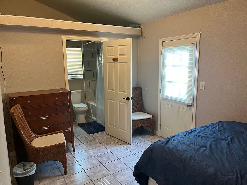 Room 1 (has door leading to back yard)