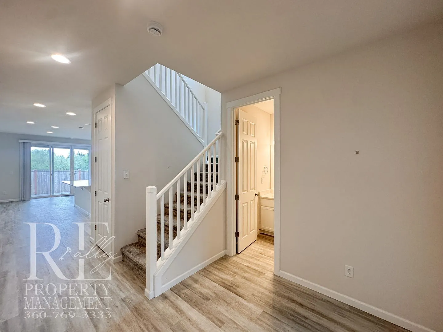 Naturally Lit 5-Bedroom Home with Fireplace, Main-Level Bedroom & Fenced Backyard — Photo 4