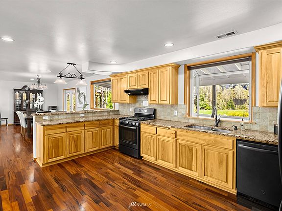Huge chef's style kitchen with garden window overlooking the views. 