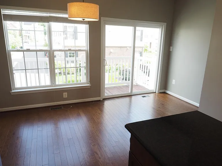 Dining area with sliding doors opening to deck.