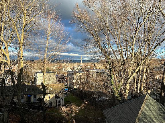 View from kitchen window overlooking downtown Chicopee and the Mt. Tom Range