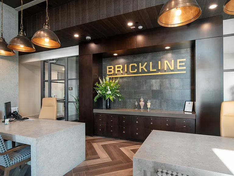 Modern reception area at Brickline with sleek design and bold branding.