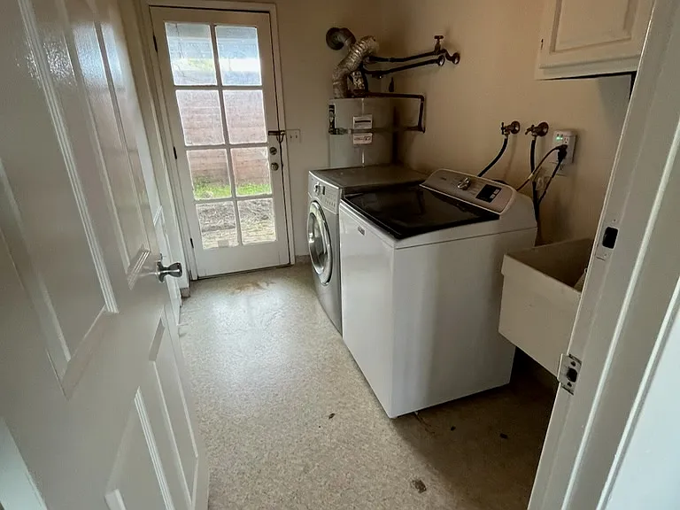 Laundry room with backyard entrance