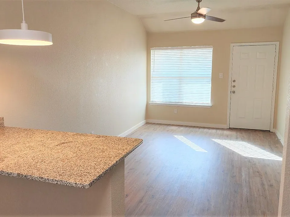 2" faux wood blinds in living room.