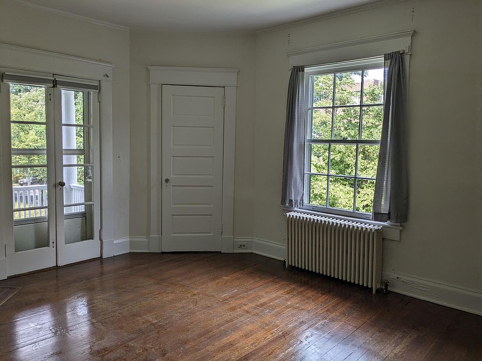 Front west/north bedroom, french doors go to the porch.