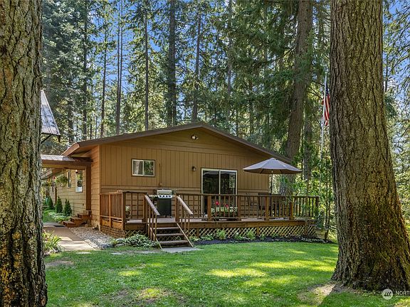 A perfect place to enjoy your morning coffee on the deck, with direct access from the primary bedroom.>