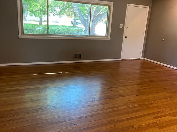 Large spacious, light filled, living room with street/tree view.