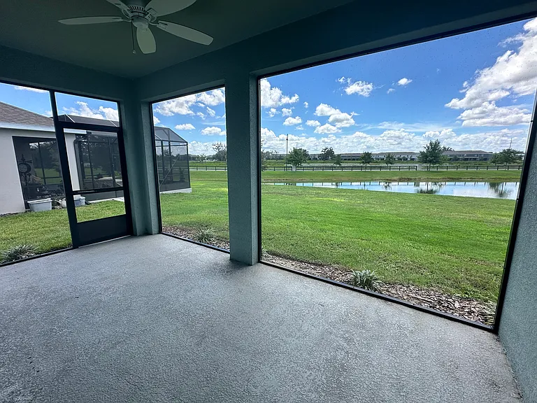 Private screened-in Lanai with views of pond.