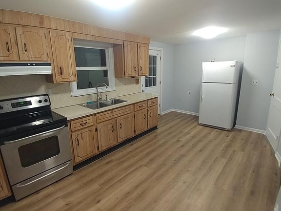 Kitchen on Main Level, Adjacent to Family Room.

Kitchen has a New Stove and New Refrigerator (not shown in picture) and Updated Flooring.