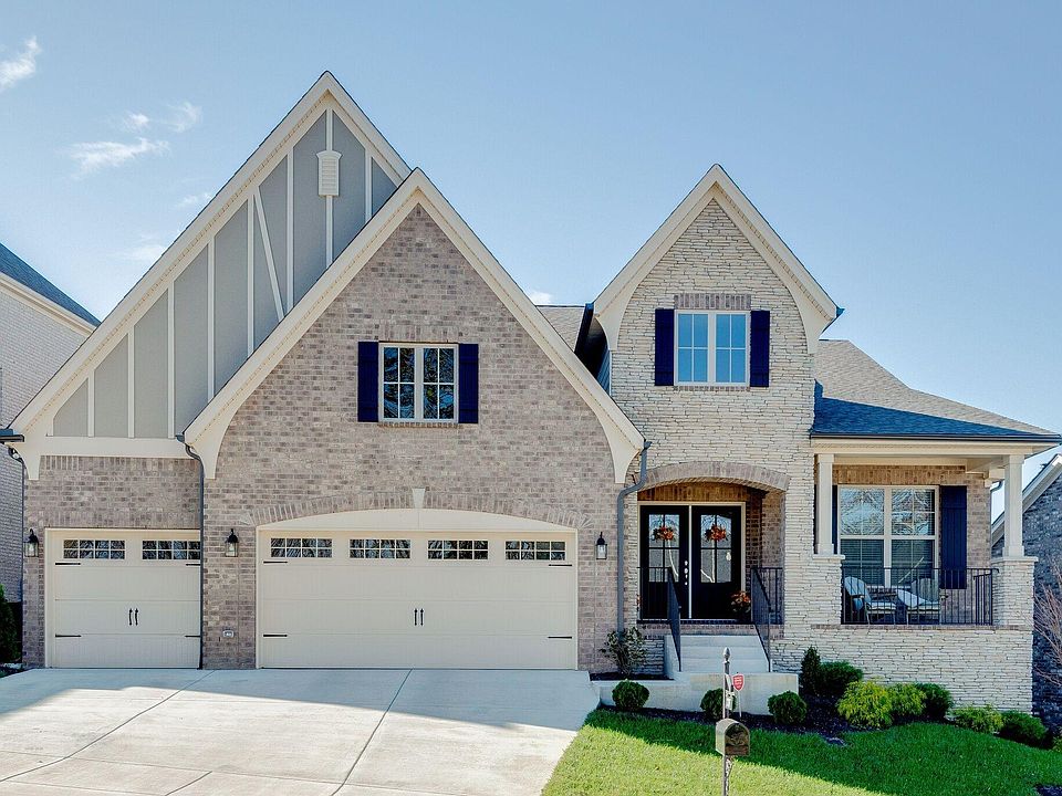 Front of home- Porch and 3 car garage