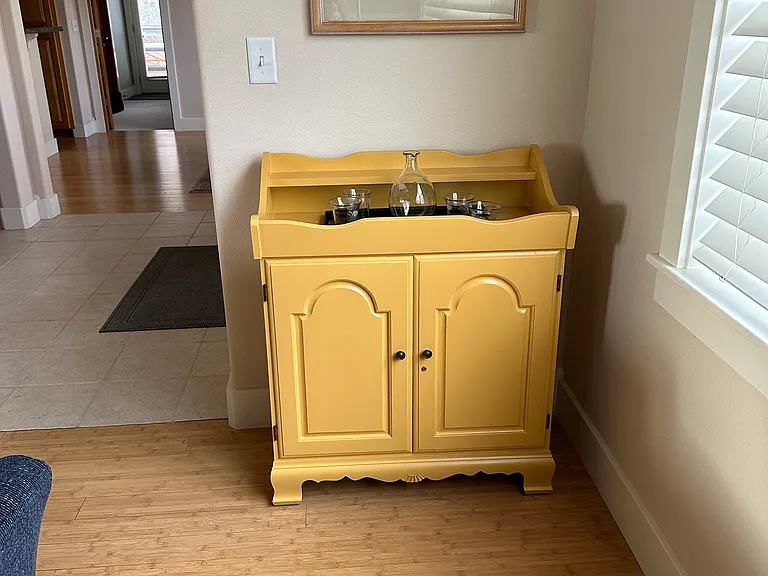 Bamboo floors and small wine cabinet