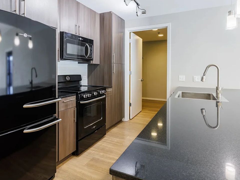 Modern Spacious Kitchen With Huge Granite Island