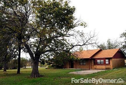 MAIN HOUSE : Sits on 5 acre fenced parcel with cath pen and pond