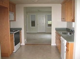 Kitchen opens to living room on one end and dining room on the other!