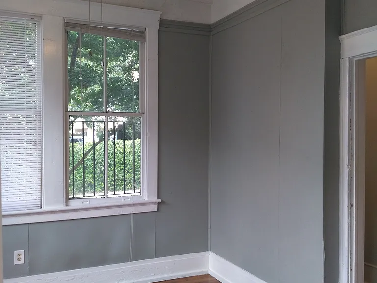 Light & airy corner room. Versatile floorplan of apartment allows this room to serve as the living room or as a bedroom.