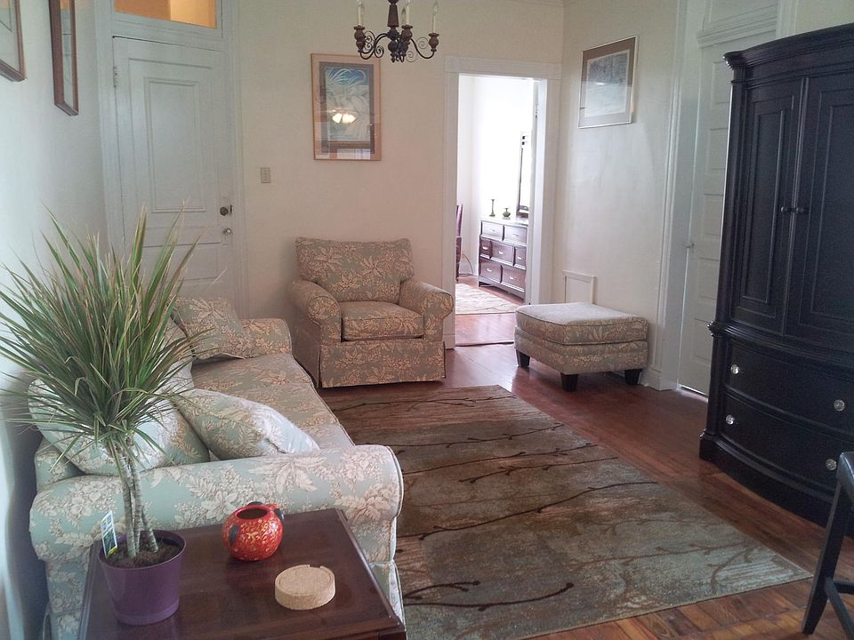 living room looking toward front bedroom. Front door is the door to the left.