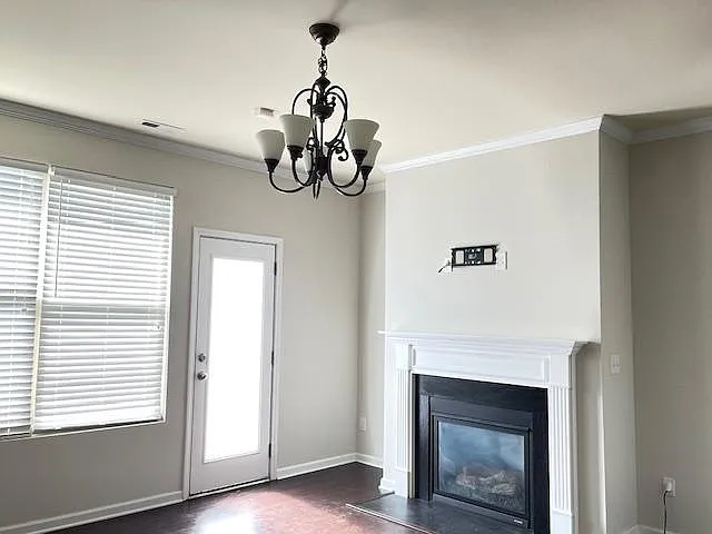 Living room with door going out to back patio