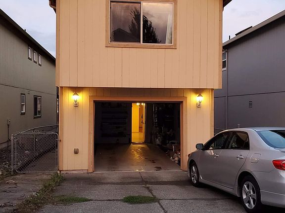 back of house, one car garage and can park 2-3 additional vehicles