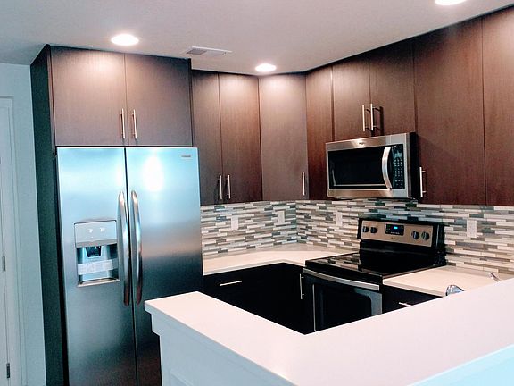 Beautiful modern kitchen with stainless steel appliances. Soft-close cabinetry