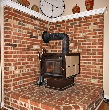 Virginia red brick Raised Hearth Corner Wood Stove in Family Room!