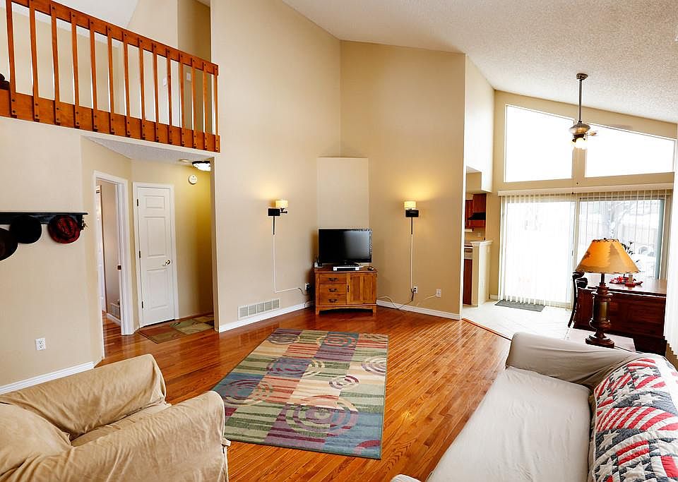 Gleaming Oak hardwood floors & vaulted ceiling