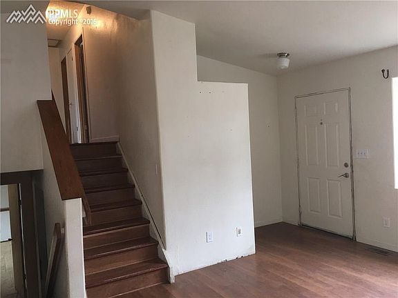 entry and stairs going to upper level and lower level