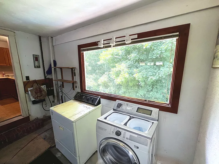 The garage features an included dryer and washer! Along with a big window and garage door to the driveway! With plenty of storage in between!