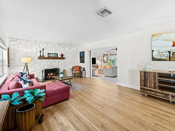 Living room with working fireplace .