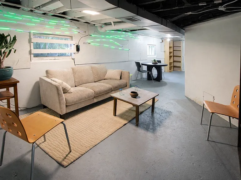 Daylight basement/den/media area.